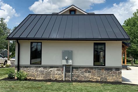 black raised seam metal siding historic house|black siding house designs.